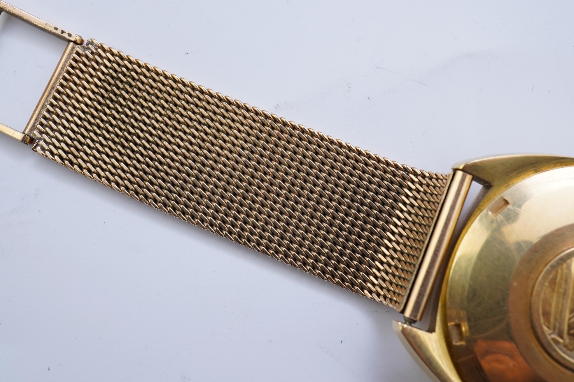 A gentleman's late 1960's 18ct gold Omega Constellation Automatic Chronometer Officially Certified wrist watch, on an associated 9ct gold mesh link bracelet